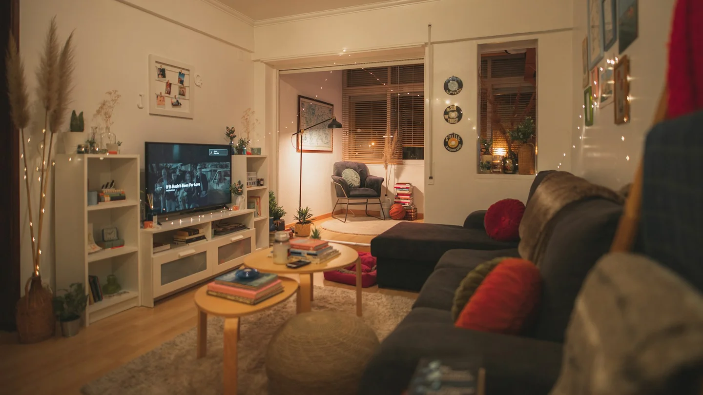 Cosy, well-lit living room interior — illustrative household setting